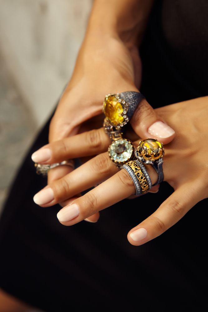 treasor gold a woman wearing precious rings